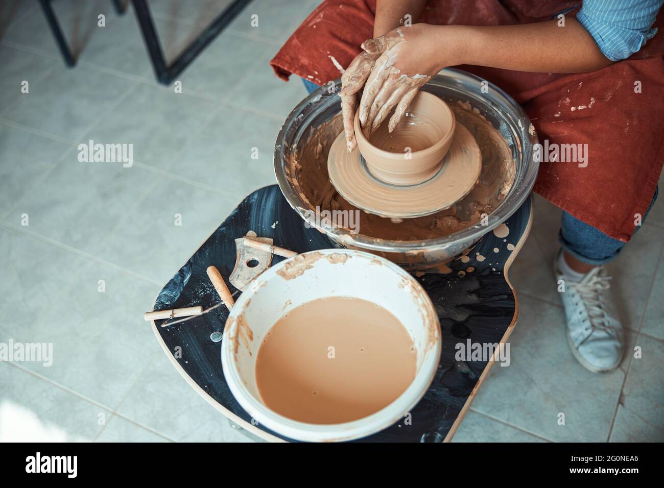 Female ceramist making clay bowl in pottery workshop Stock Photo - Alamy