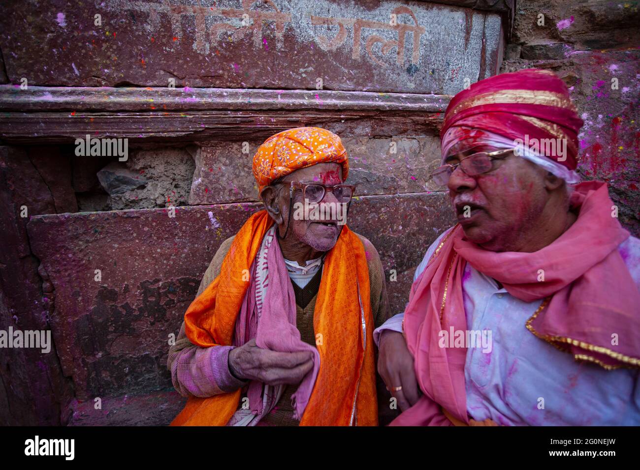 Two aged person interacting at the holi festival in India Stock Photo