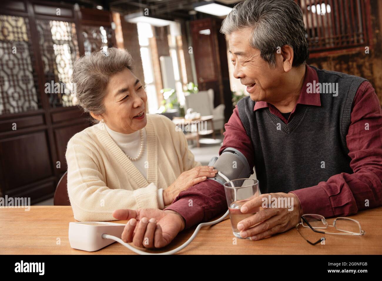 Elderly blood pressure asia hi-res stock photography and images - Alamy