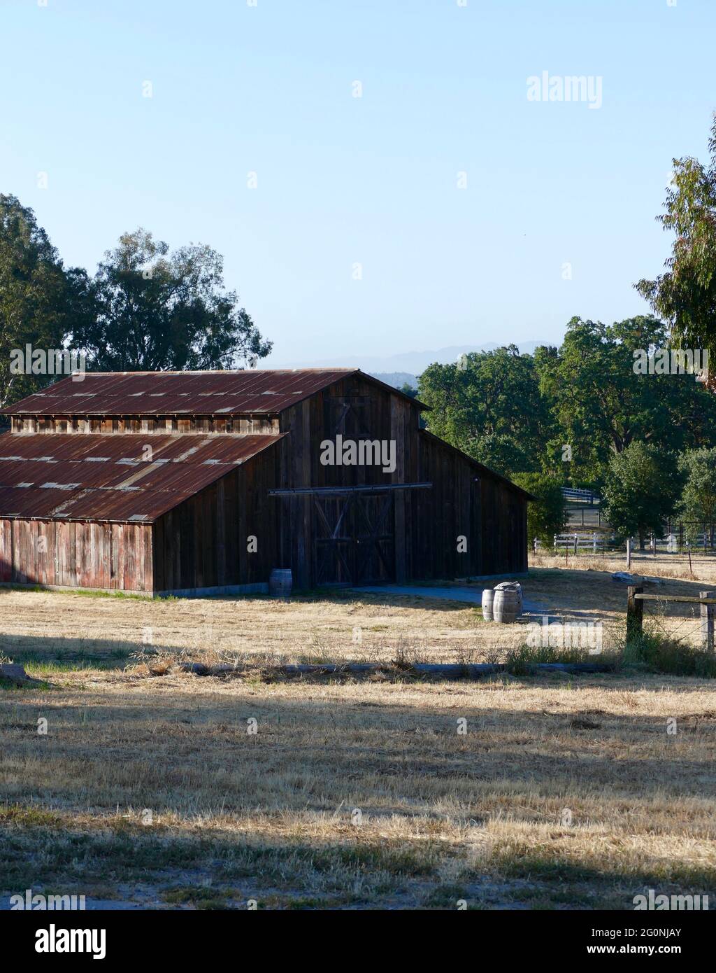 vintage red rustic barn out in the countryside Stock Photo