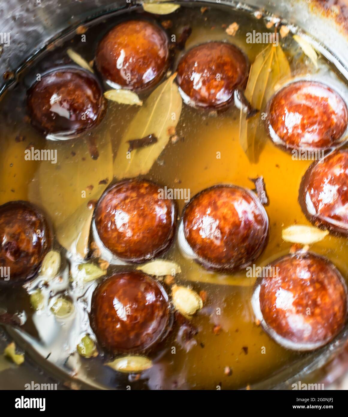 indian sweet Gulab jamun in sweet sugar syrup for the celebration of the festival. Stock Photo