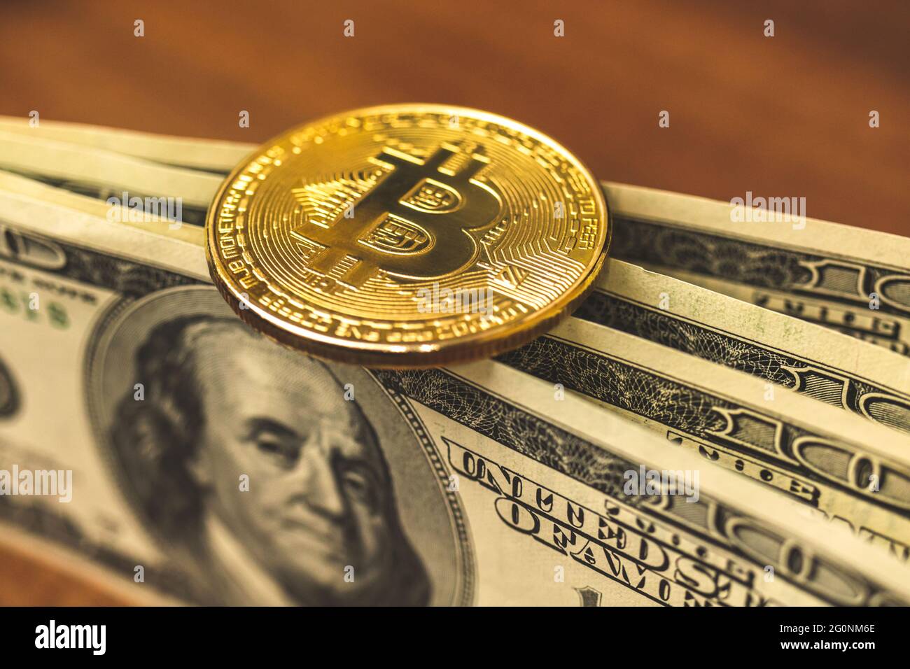 Bitcoin on dollar banknotes bills close up photo of crypto currency and real  money Stock Photo - Alamy