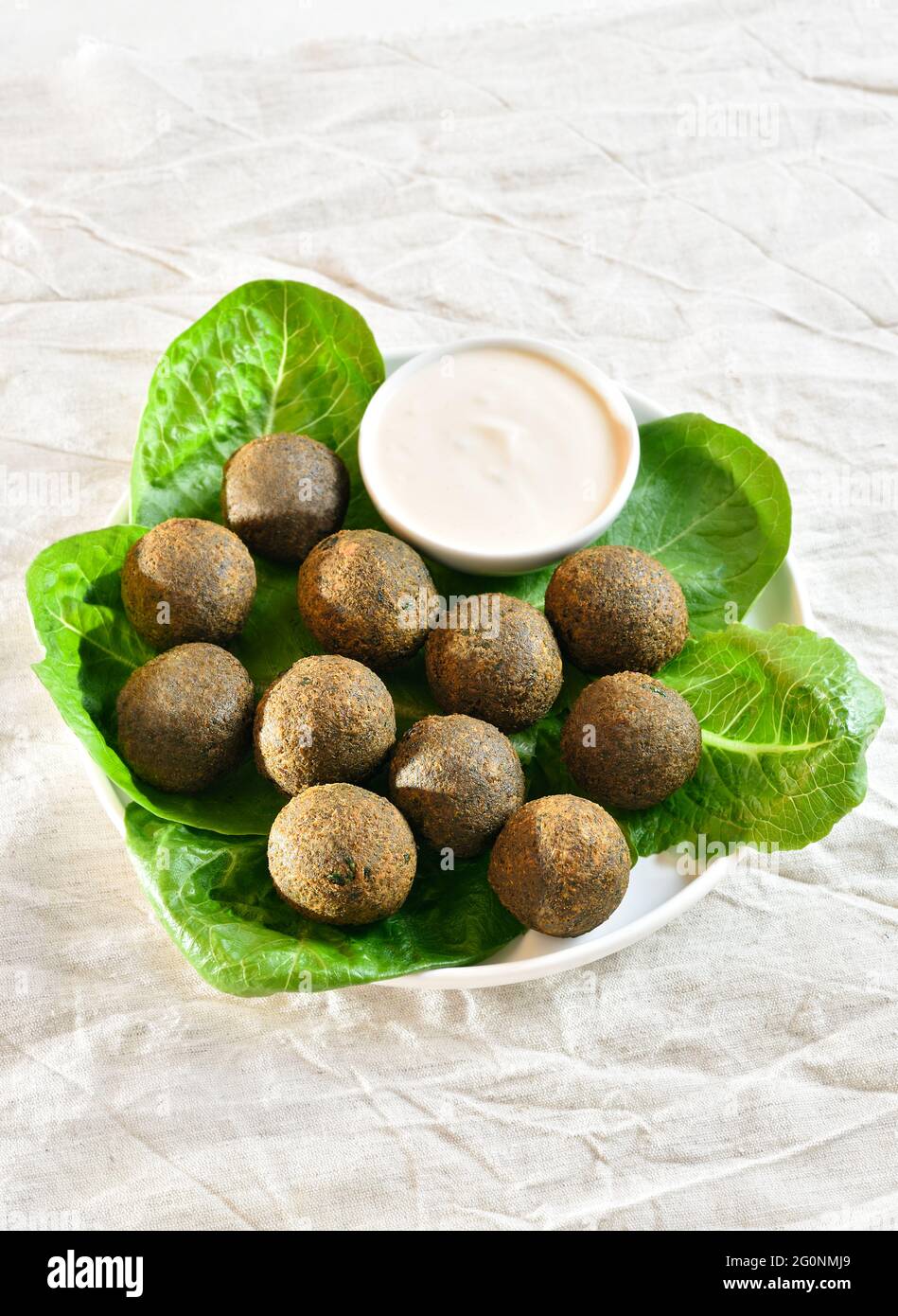 Falafel balls with sauce. Deep fried balls from ground chickpeas