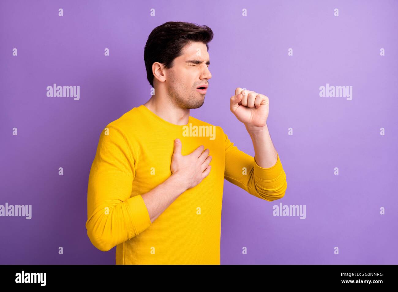 Portrait of young person closed eyes arm on chest coughing feel bad