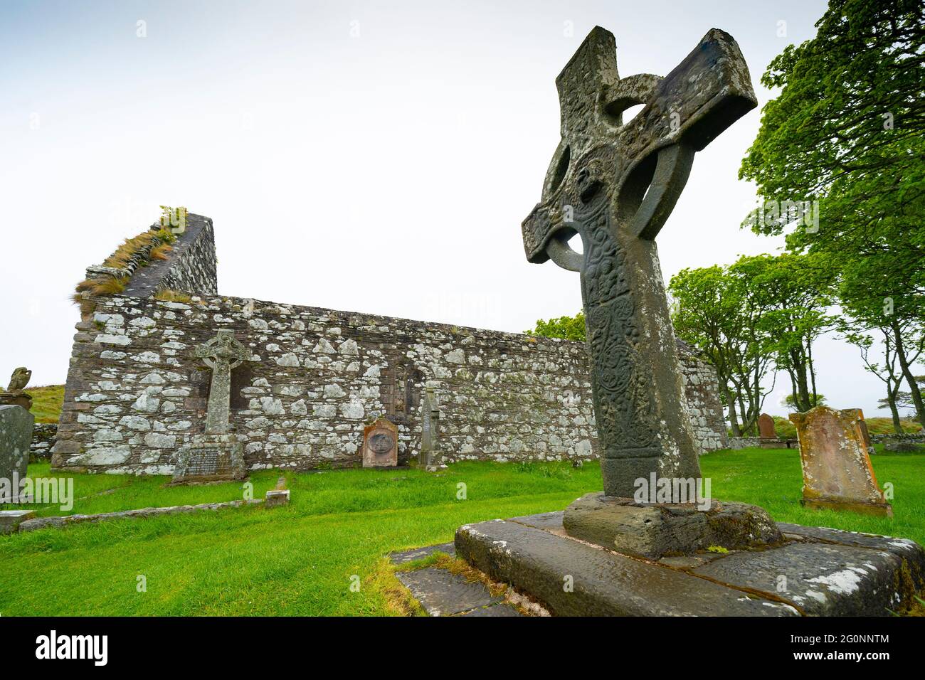 Kildalton High Cross and Kildalton Parish church on Islay, Inner Hebrides, Scotland UK Stock Photo