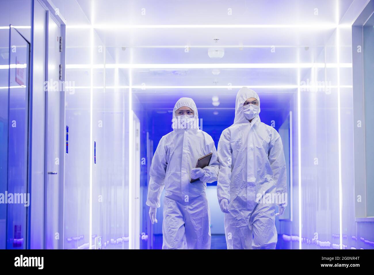 Wearing dusters of technical personnel in the hallway Stock Photo