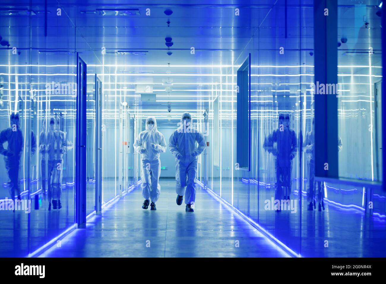 Wearing dusters of technical personnel in the hallway Stock Photo