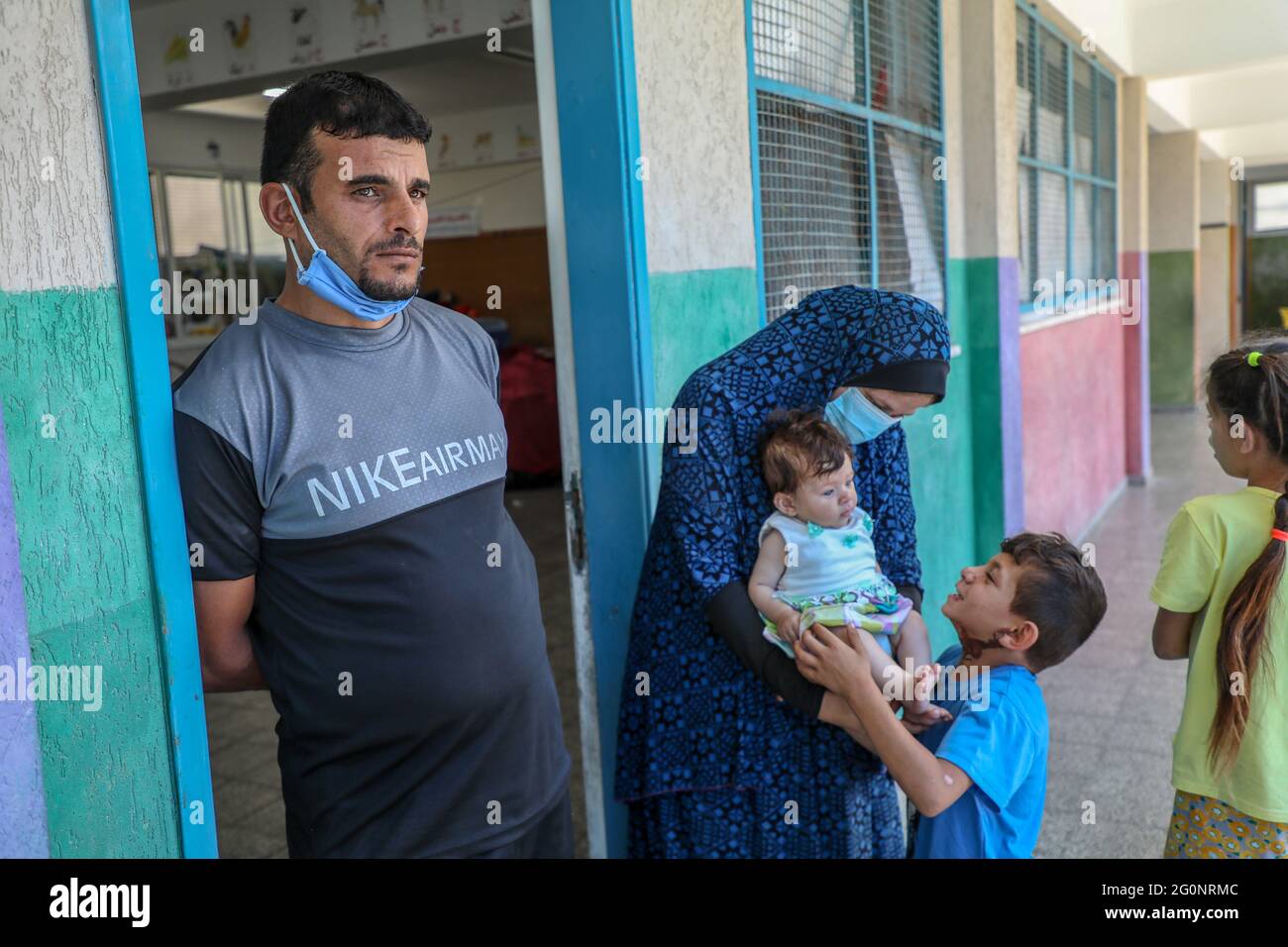 Palestinian families live in the UNRWA school because their homes were completely destroyed during the Israeli aggression on Gaza. Gaza City. Stock Photo