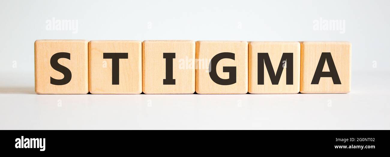 Stigma symbol. Wooden cubes with the word 'stigma'. Beautiful white