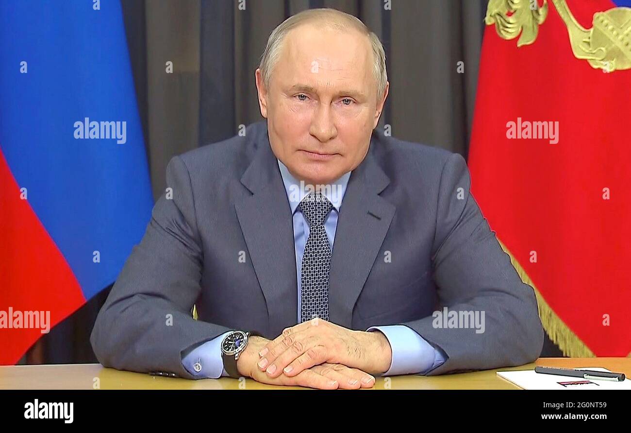Russian President Vladimir Putin delivers a video address to participants of Bolshaya Peremena festival from the official Bocharov Ruchei residence at Cape Idokopas June 1, 2021 in Sochi, Russia. Stock Photo