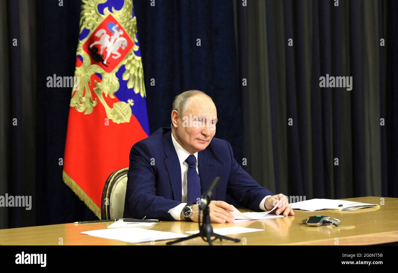 Russian President Vladimir Putin hosts a video conference meeting with families awarded the Order of Parental Glory from the official Bocharov Ruchei residence at Cape Idokopas June 1, 2021 in Sochi, Russia. Stock Photo