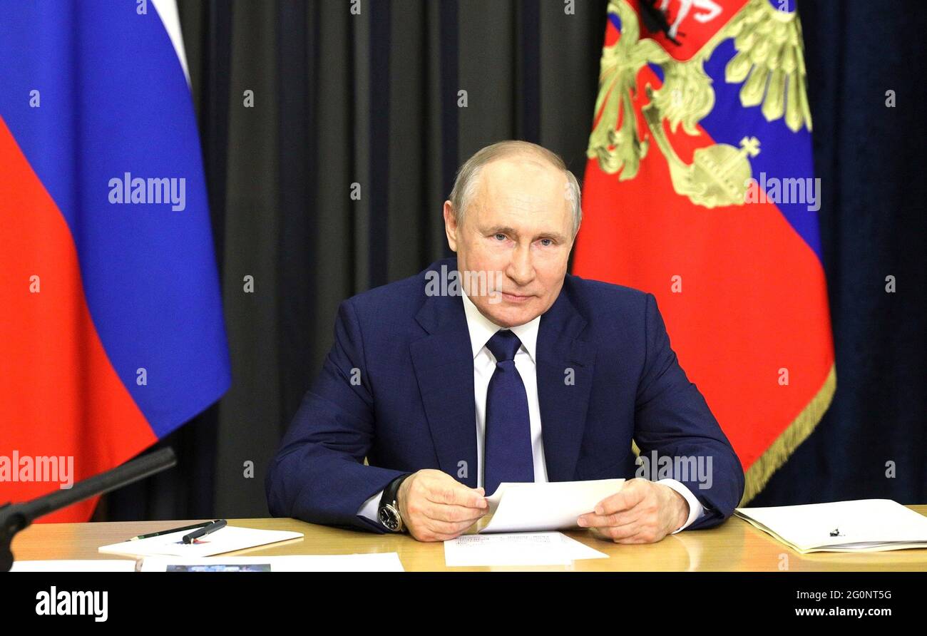 Russian President Vladimir Putin hosts a video conference meeting with families awarded the Order of Parental Glory from the official Bocharov Ruchei residence at Cape Idokopas June 1, 2021 in Sochi, Russia. Stock Photo