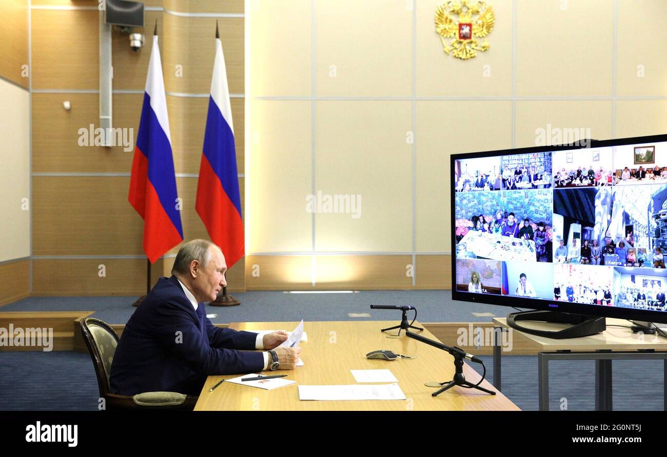 Russian President Vladimir Putin hosts a video conference meeting with families awarded the Order of Parental Glory from the official Bocharov Ruchei residence at Cape Idokopas June 1, 2021 in Sochi, Russia. Stock Photo