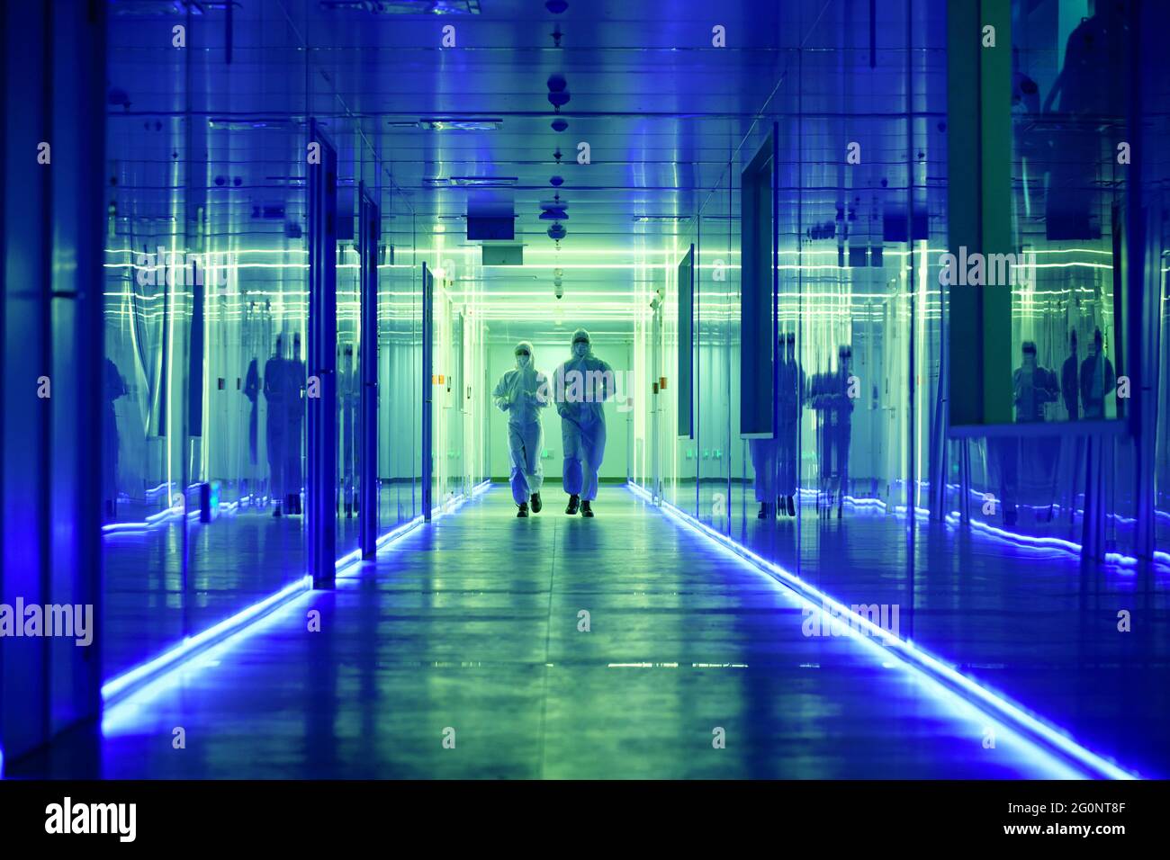 Wearing dusters of technical personnel in the hallway Stock Photo