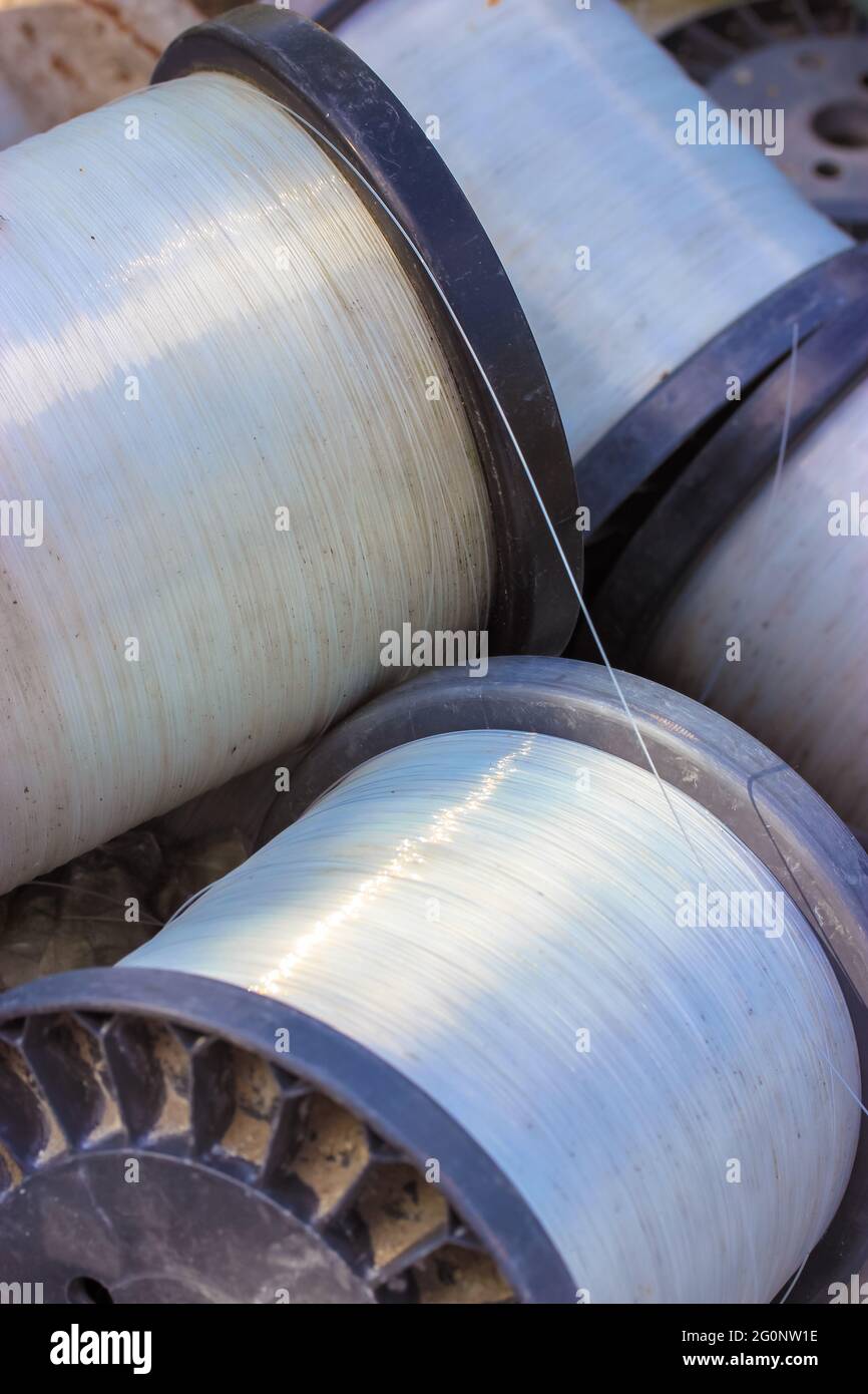 Large vintage plastic spools with sturdy transparent white fishing line  close-up. Clear nylon line in roll for fishing or construction work.  Fishing t Stock Photo - Alamy