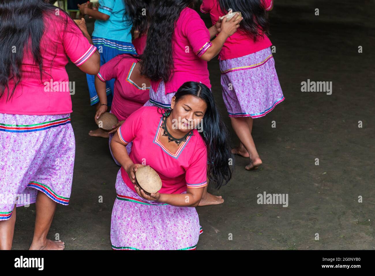 Indigenous Kichwa or Quechua women performing a community dance in an