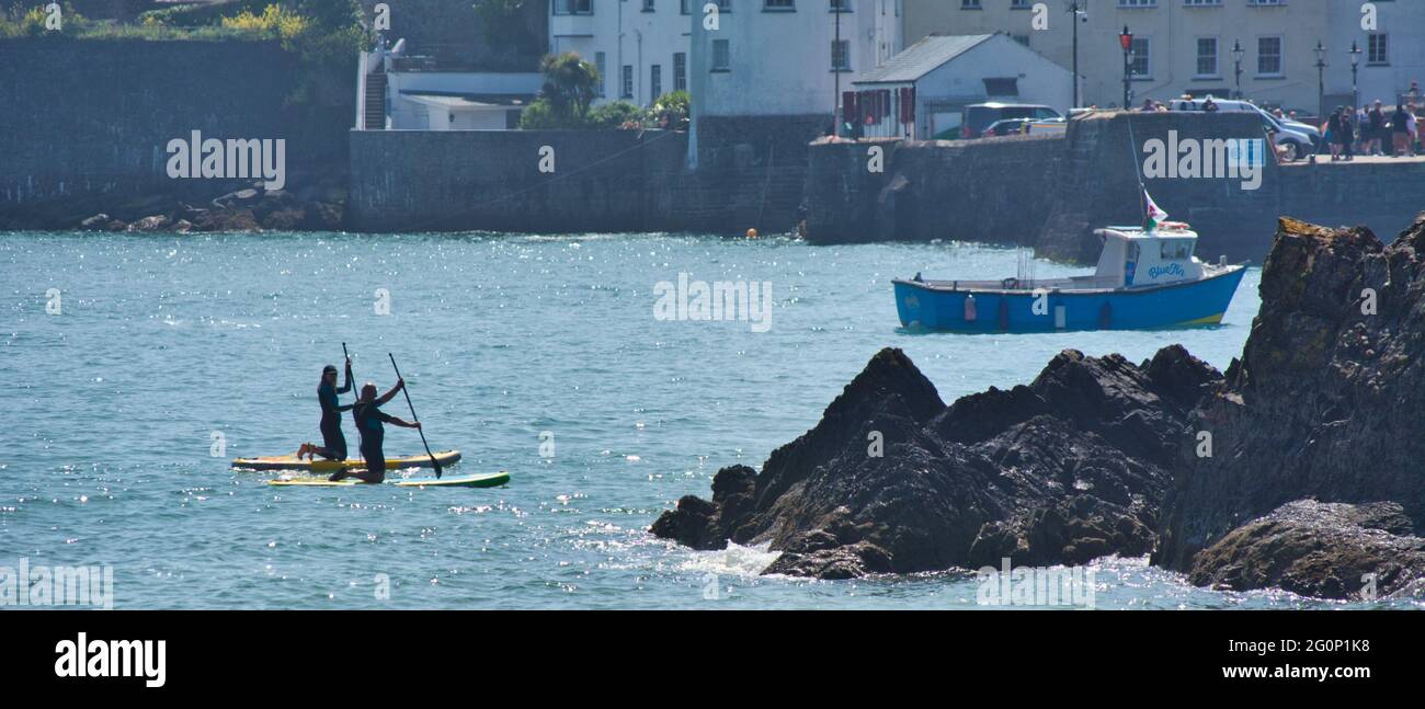 Paddle boarding lesson in Tenby,Wales,UK Stock Photo - Alamy