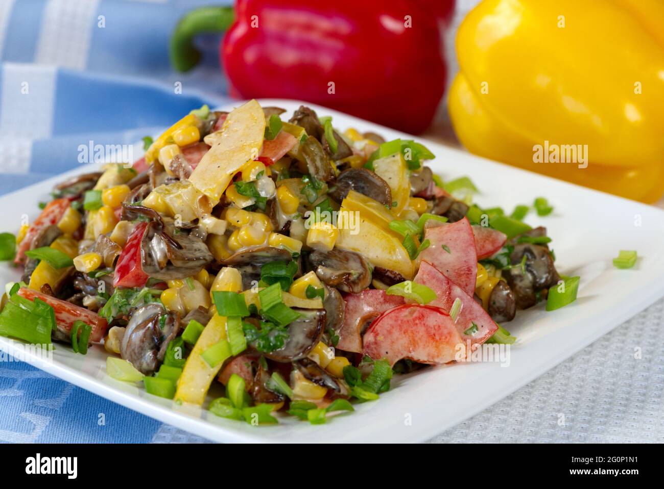 salat with fresh vegetable, paprika, tomato, papper, corn mushrooms and paprika in background. Stock Photo