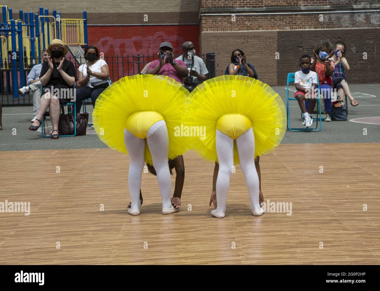 Cynthia KIng Dance Studio for kids in Brooklyn, New York holds its first performance outdoors, with masks and social distancing in the spring 2021 since the pandemic and city shutdown began over a year earlier. Stock Photo