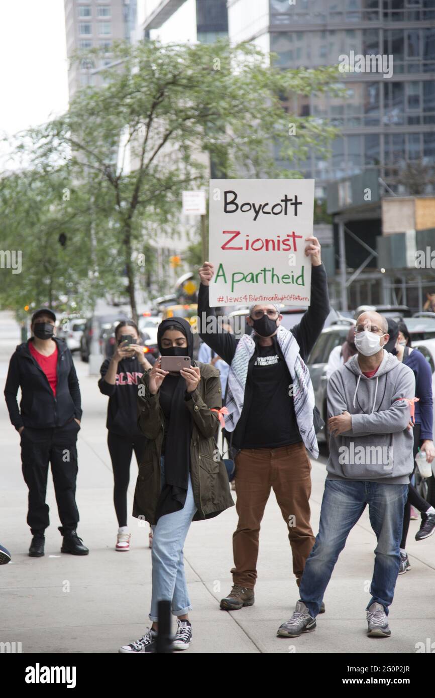 CUNY students and others demonstrate at John Jay College for CUNY to divest and cut all ties with Israel who is devestating the Palestinian people in Gaza and elsewhere in Israel. Stock Photo