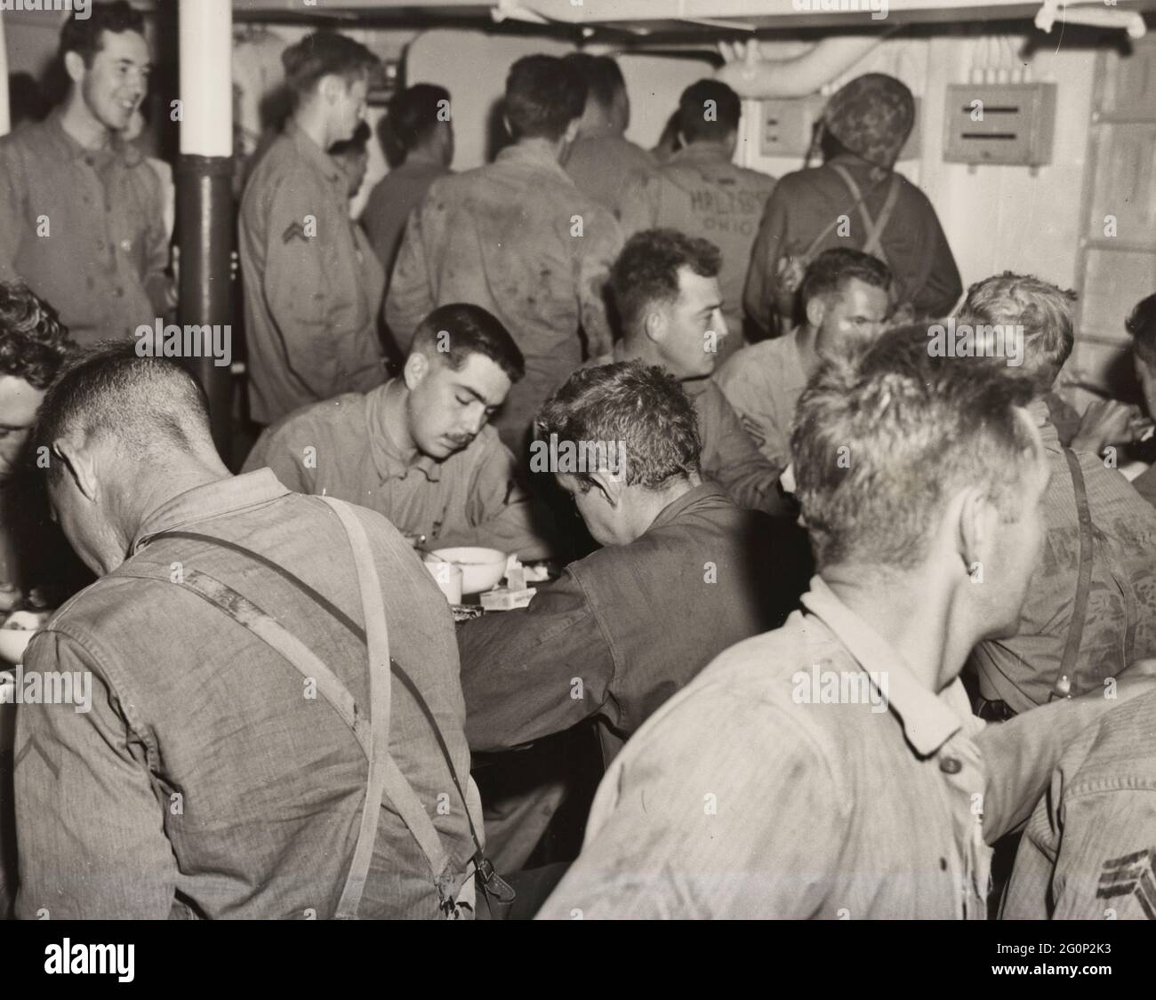 Marines have battle breakfast at 3:30 aboard one of the ships of the Inchon Invasion Fleet on the day of the landing Stock Photo