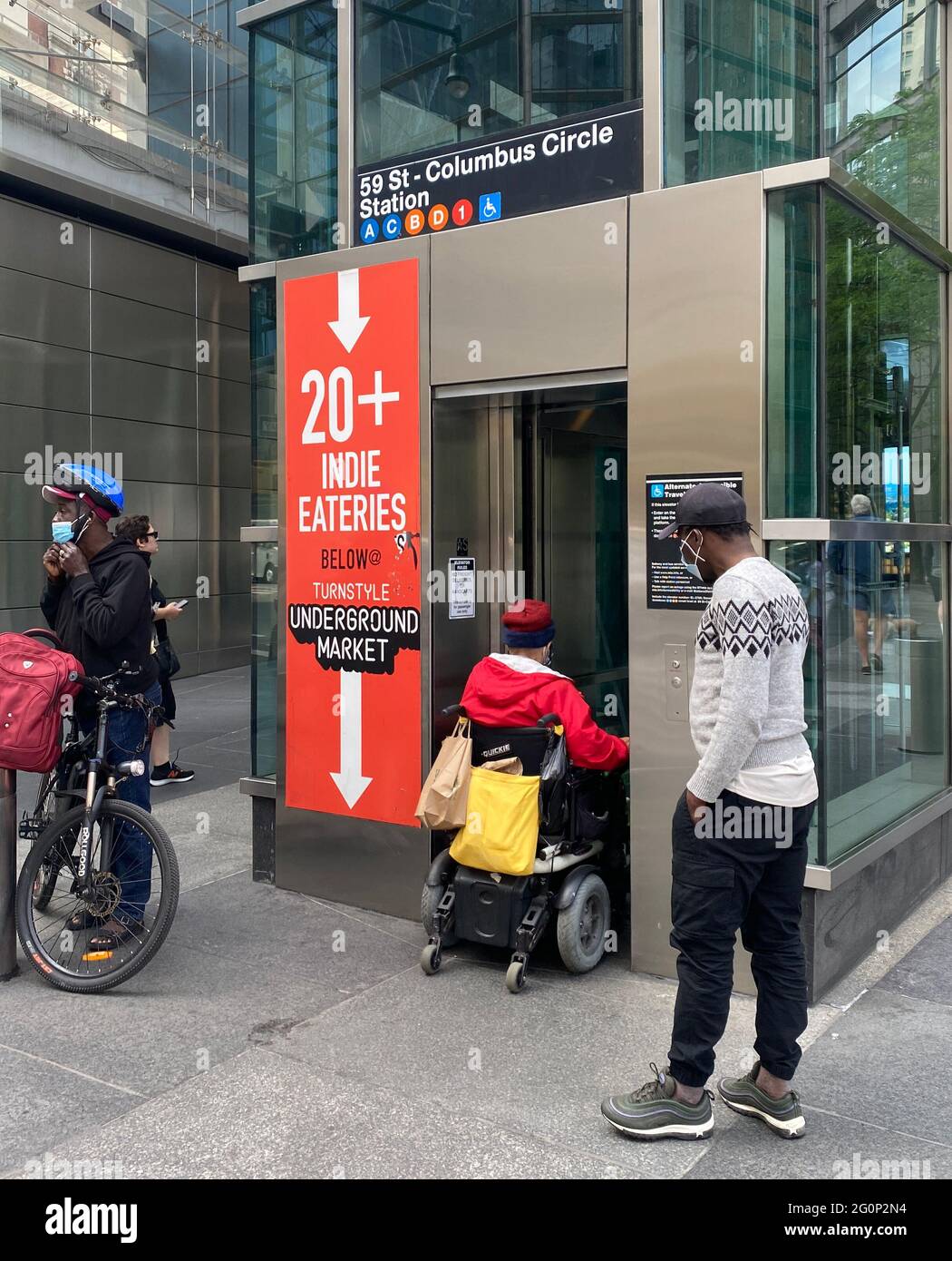 Disabled man in a wheelchair uses the elevator from the street to enter the underground subway