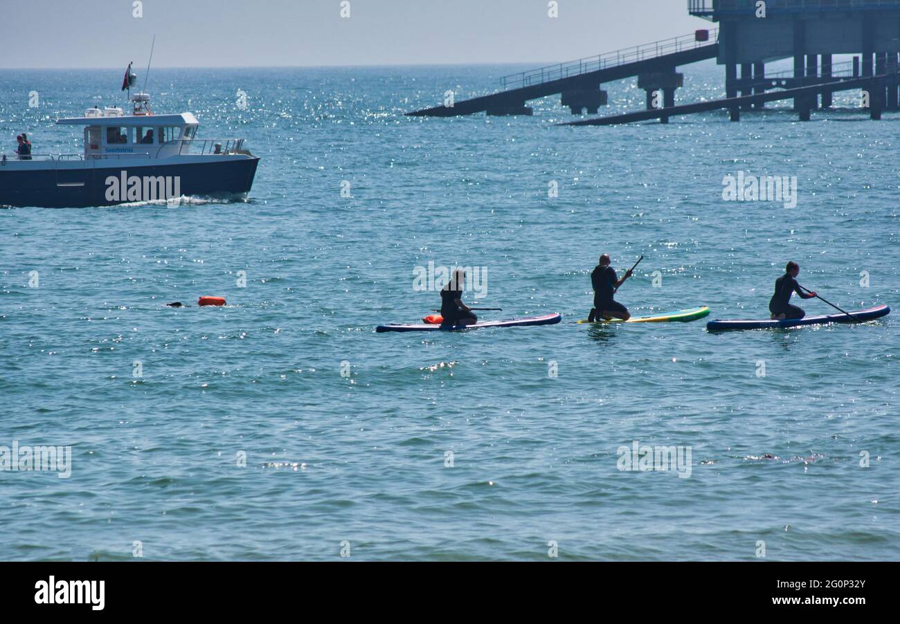 Paddle boarding lesson in Tenby,Wales,UK Stock Photo - Alamy