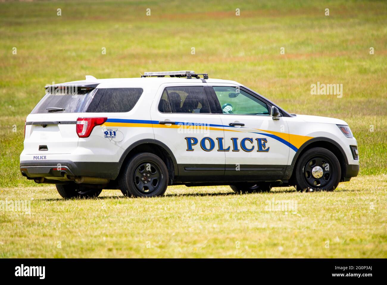 White Police Car Close Up Emergency Service On The Field At Day Stock