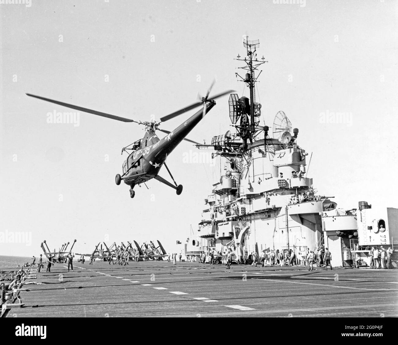 Sikorsky HO3S-1 helicopter landing on USS Boxer (CV-21) after an air-sea rescue mission, during operations off Korea. Official U.S. Navy Photograph Stock Photo
