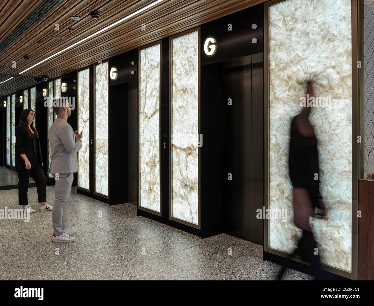 Lift lobby with feature Onyx wall. 65 Pirrama Road, Pyrmont, Australia. Architect: Gray Puksand, 2021. Stock Photo