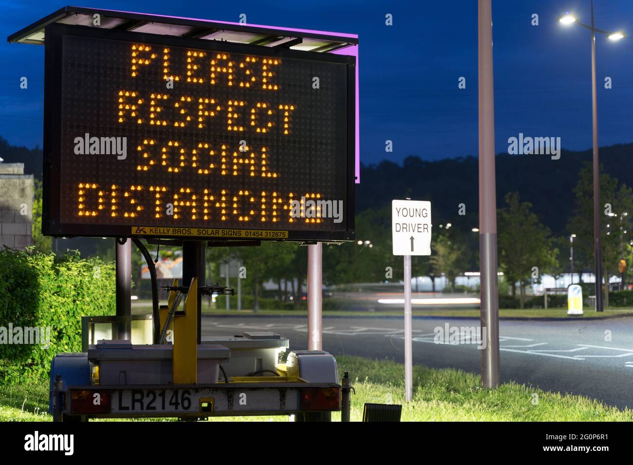 digital traffic message displaying 'Please respect social distancing', Kent, England, Europe Stock Photo