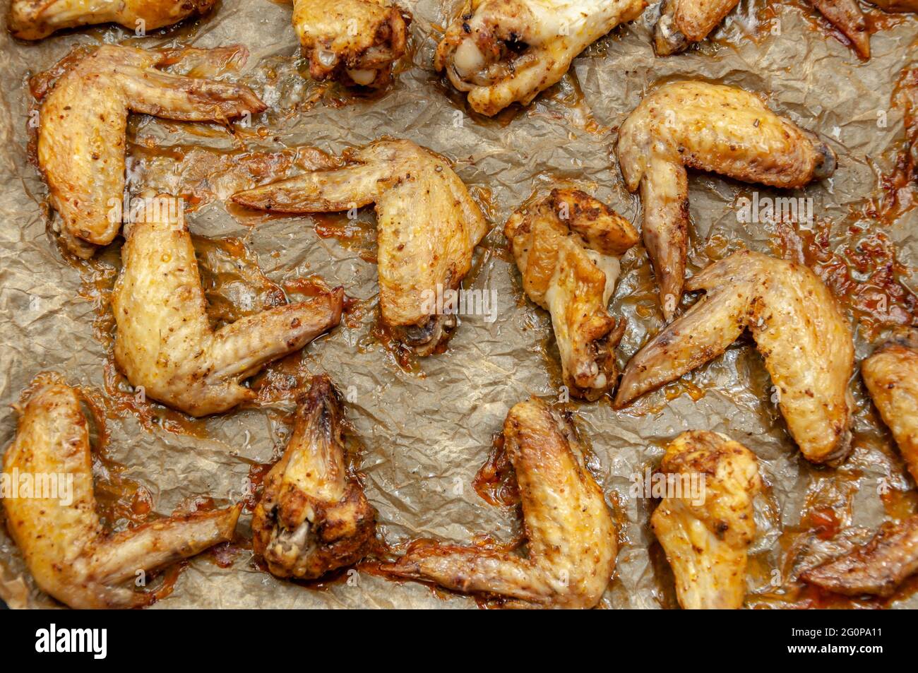 Hot and Spicey Buffalo Chicken Wings. Cooked chicken wings on parchment paper. Top view Stock