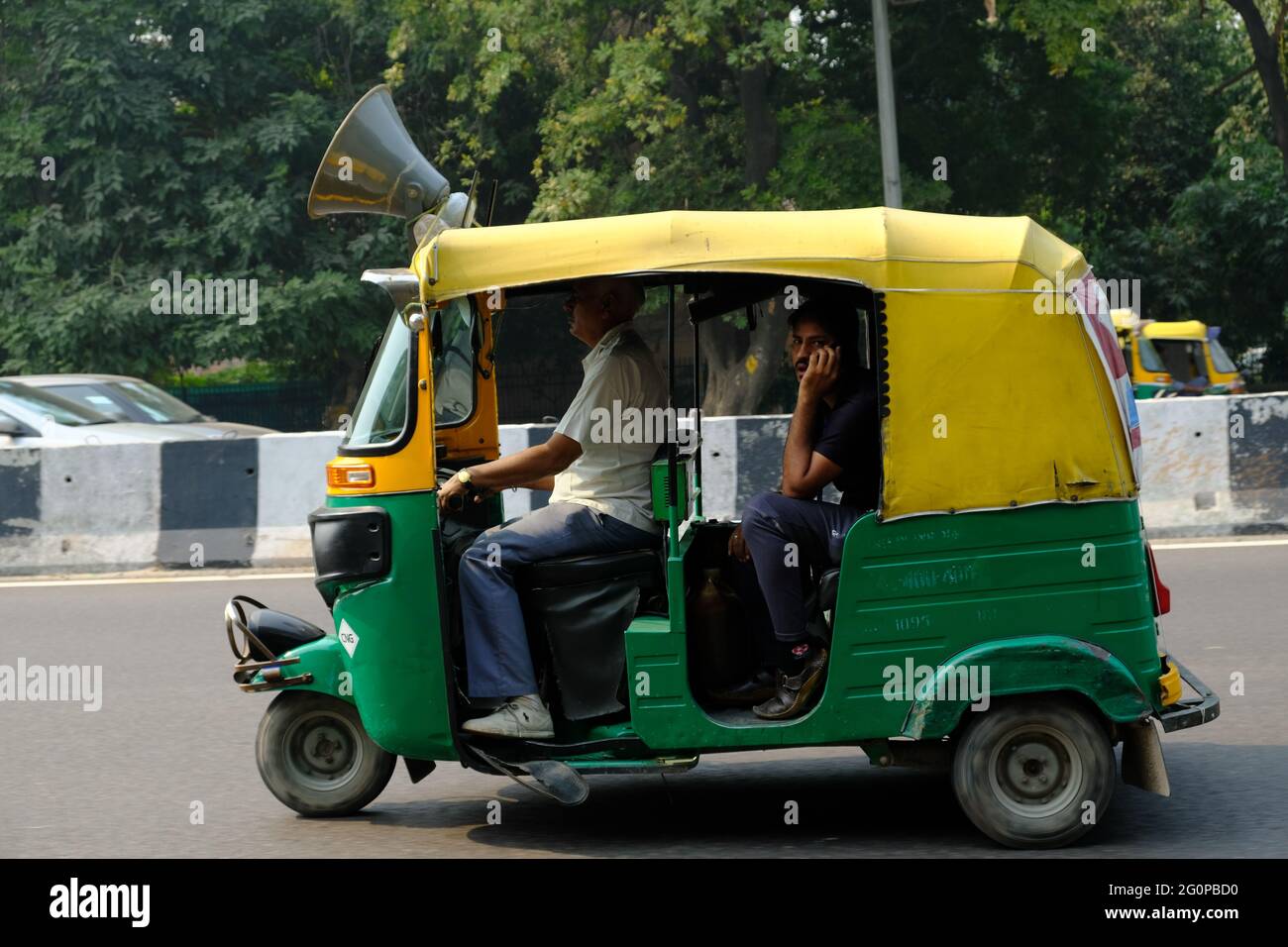 India Delhi - Driving Auto rickshaw Stock Photo