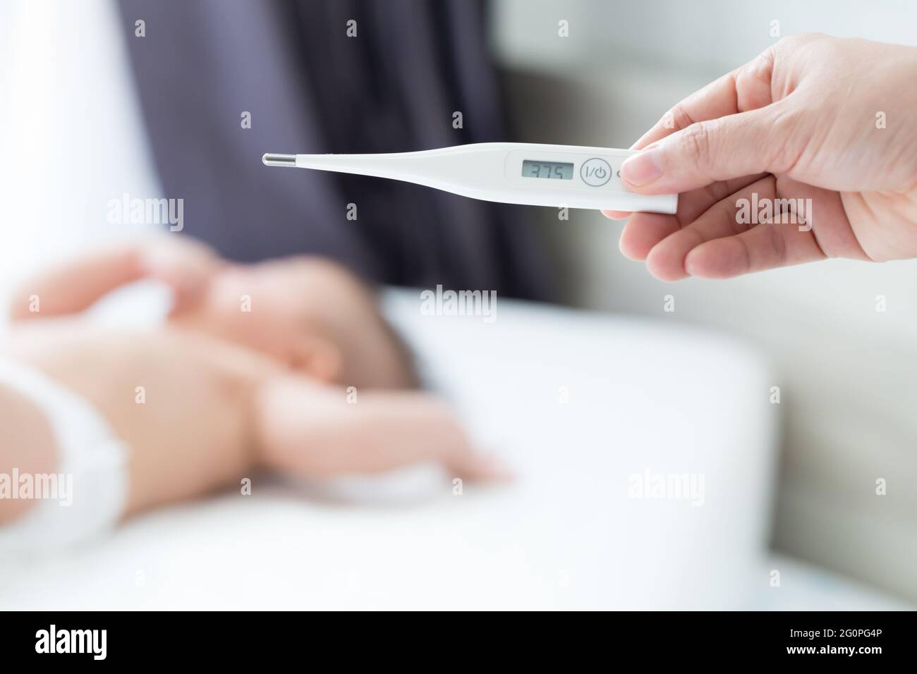 Measure the body temperature of the baby with digital thermometer
