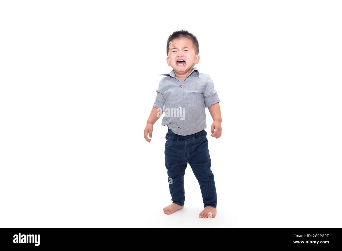 Crying baby boy and wearing business shirt isolated on white background Stock Photo
