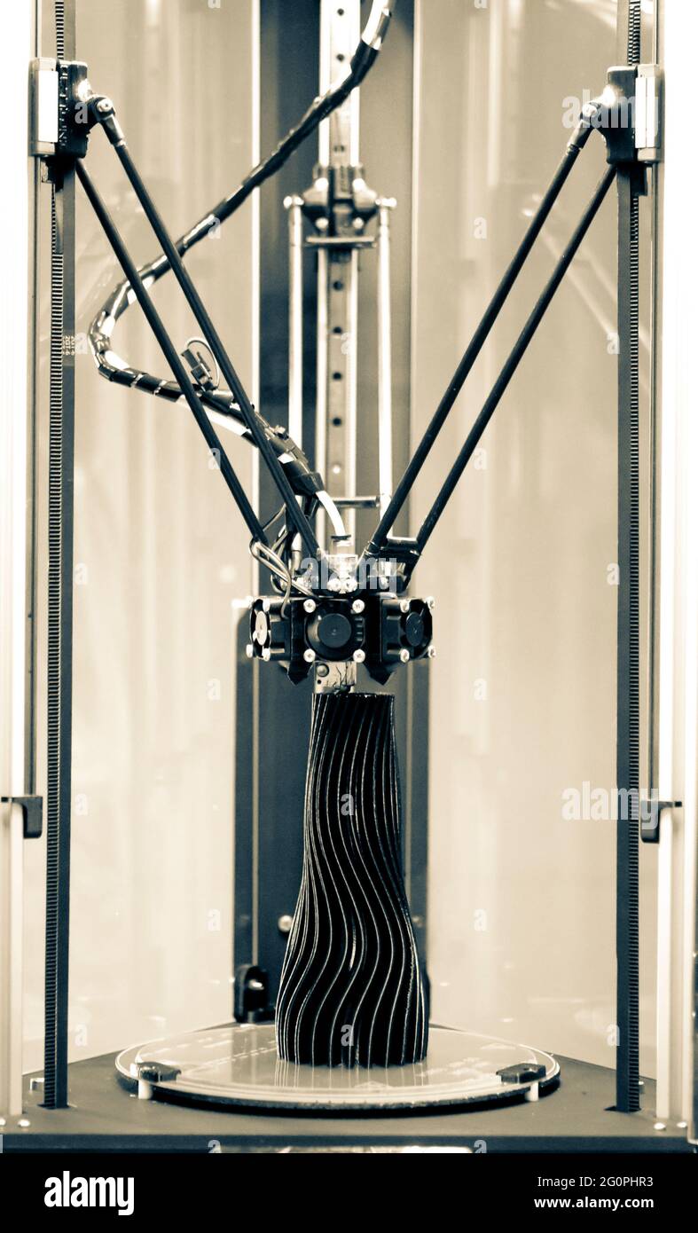 3d printer prints a model of a black vase Stock Photo - Alamy