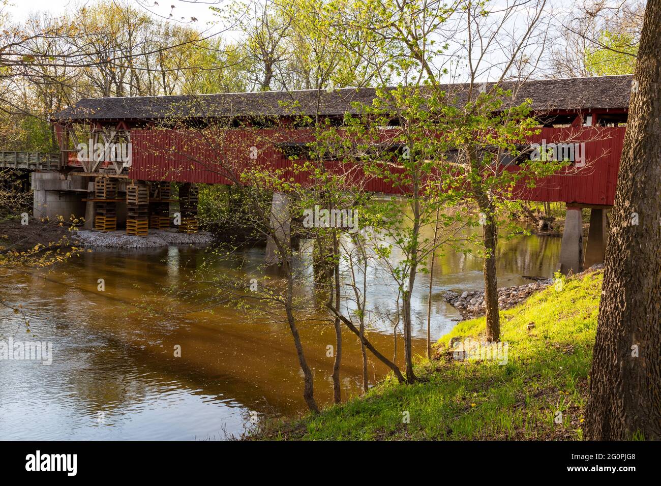 The 1873 Spencerville Covered Bridge, closed for rehabilitation, spans the St. Joseph River at Spencerville, Indiana, USA. Stock Photo