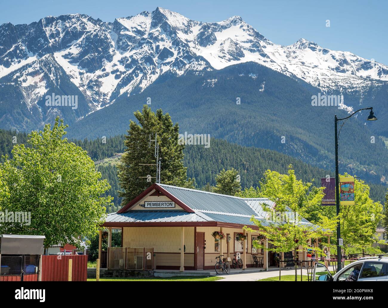 Pemberton BC, Canada - May 29, 2021 - The old train station and now visitors centre in the Village of Pemberton with Mt. Currie in the background. Stock Photo