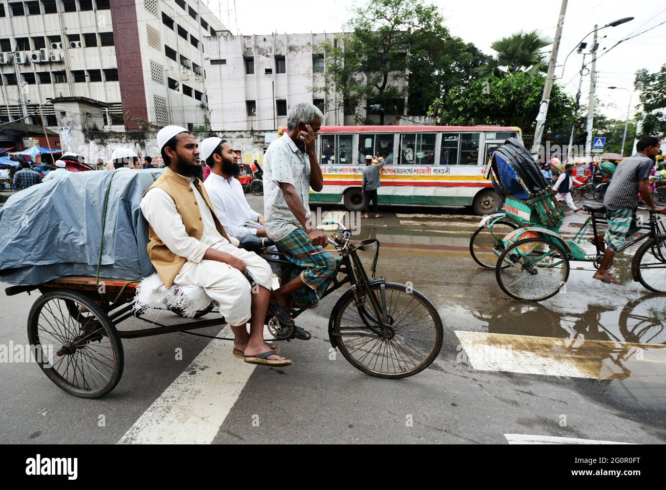 Colorful cycle rickshaws roaming the streets of Dhaka, Bangladesh Stock ...