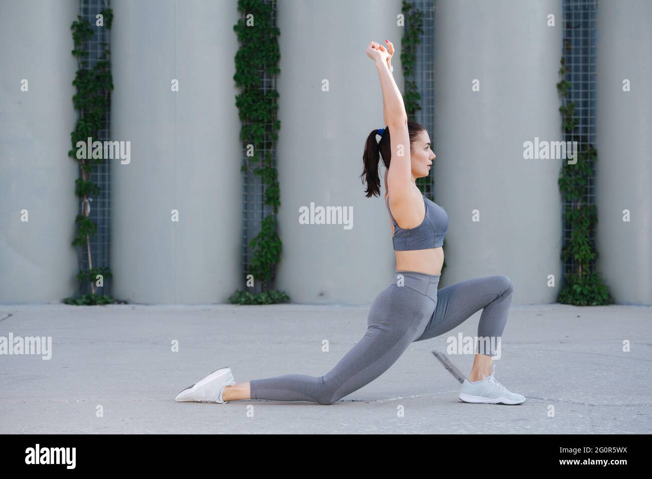 doing yoga on a concrete paving 