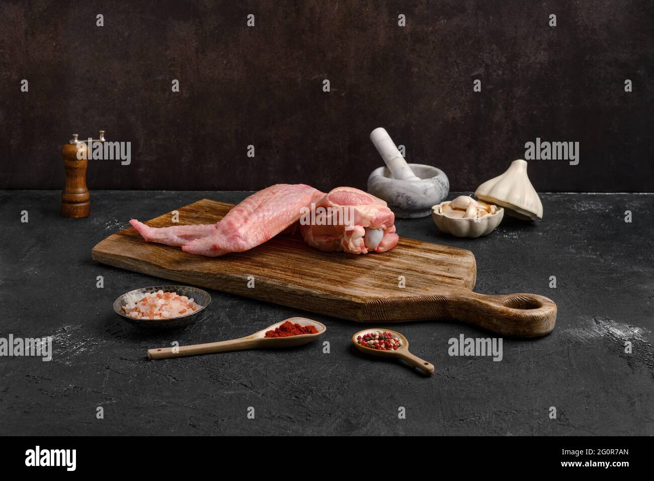 Raw turkey wings on black Slate Tray. Fresh turkey wingette on a black  stone tray Stock Photo - Alamy