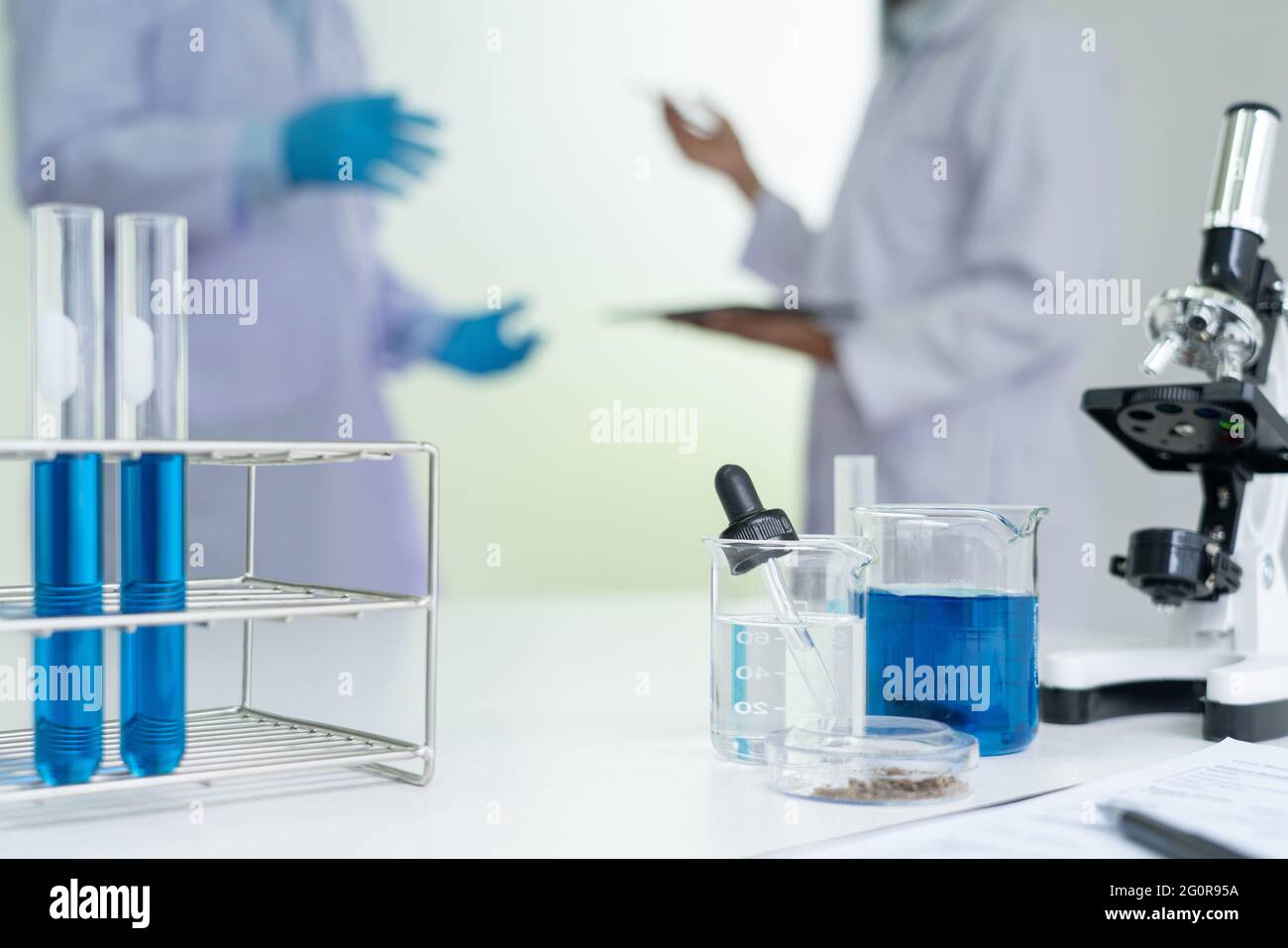 Team of Medical Research Scientists or researcher in lab coat testing ...