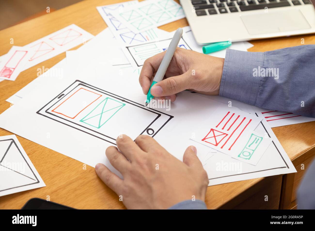 UX Graphic designer creative sketch and planning prototype wireframe for web mobile phone. Application development and user experience concept Stock Photo