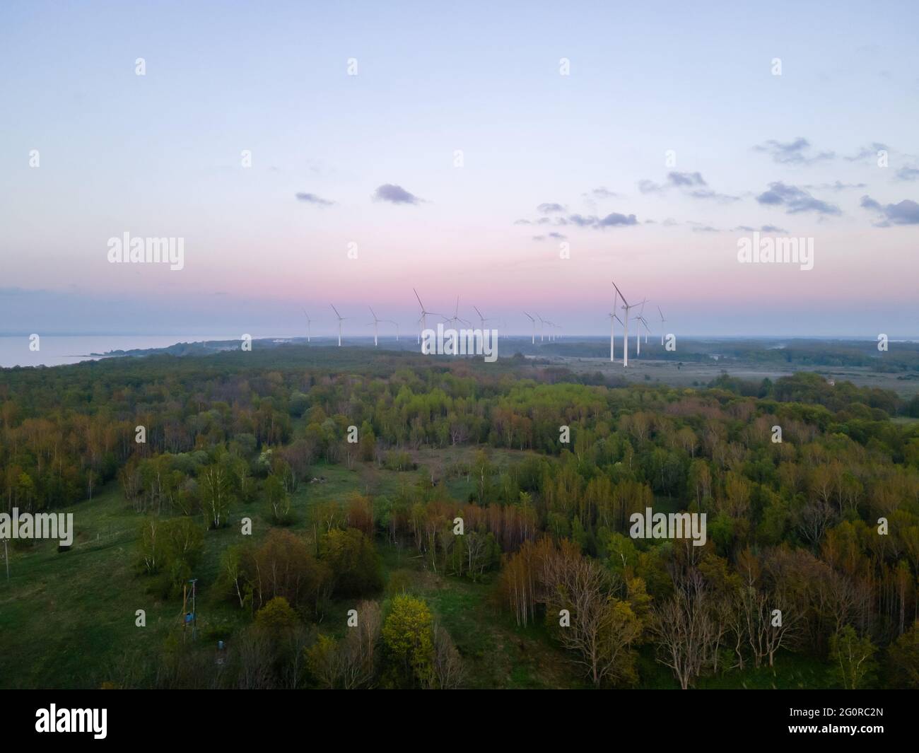 Wind turbines on sunset at summer evening. Renewable energy Stock Photo ...