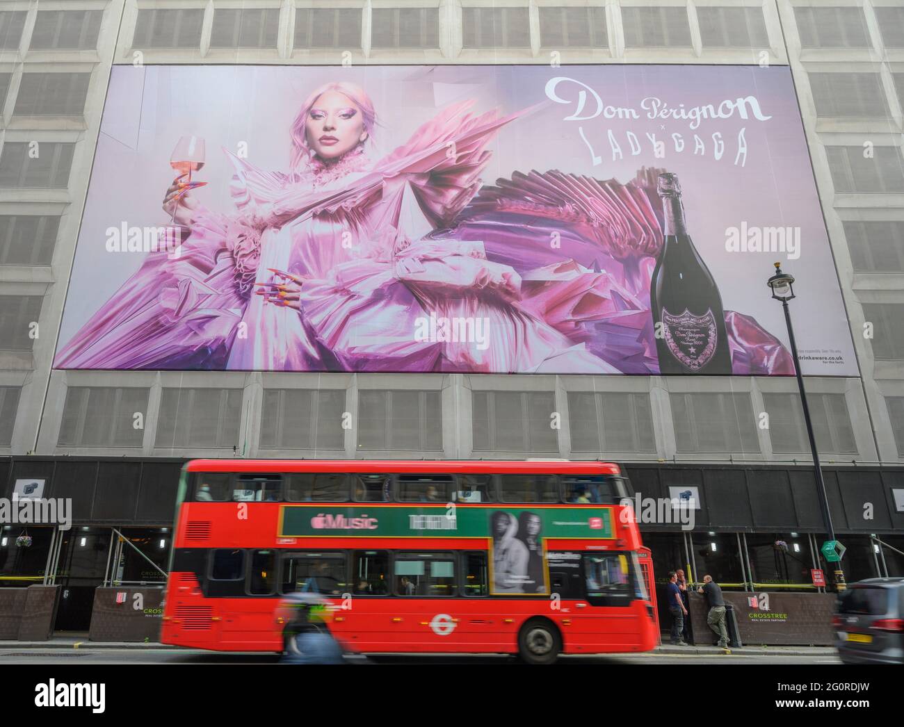 Piccadilly, London, UK. 3 June 2021. A giant poster depicting Lady Gaga and Dom Perignon Champagne dominates the facade of a building under renovation in Piccadilly, opposite the Ritz Hotel. Credit: Malcolm Park/Alamy Live News. Stock Photo