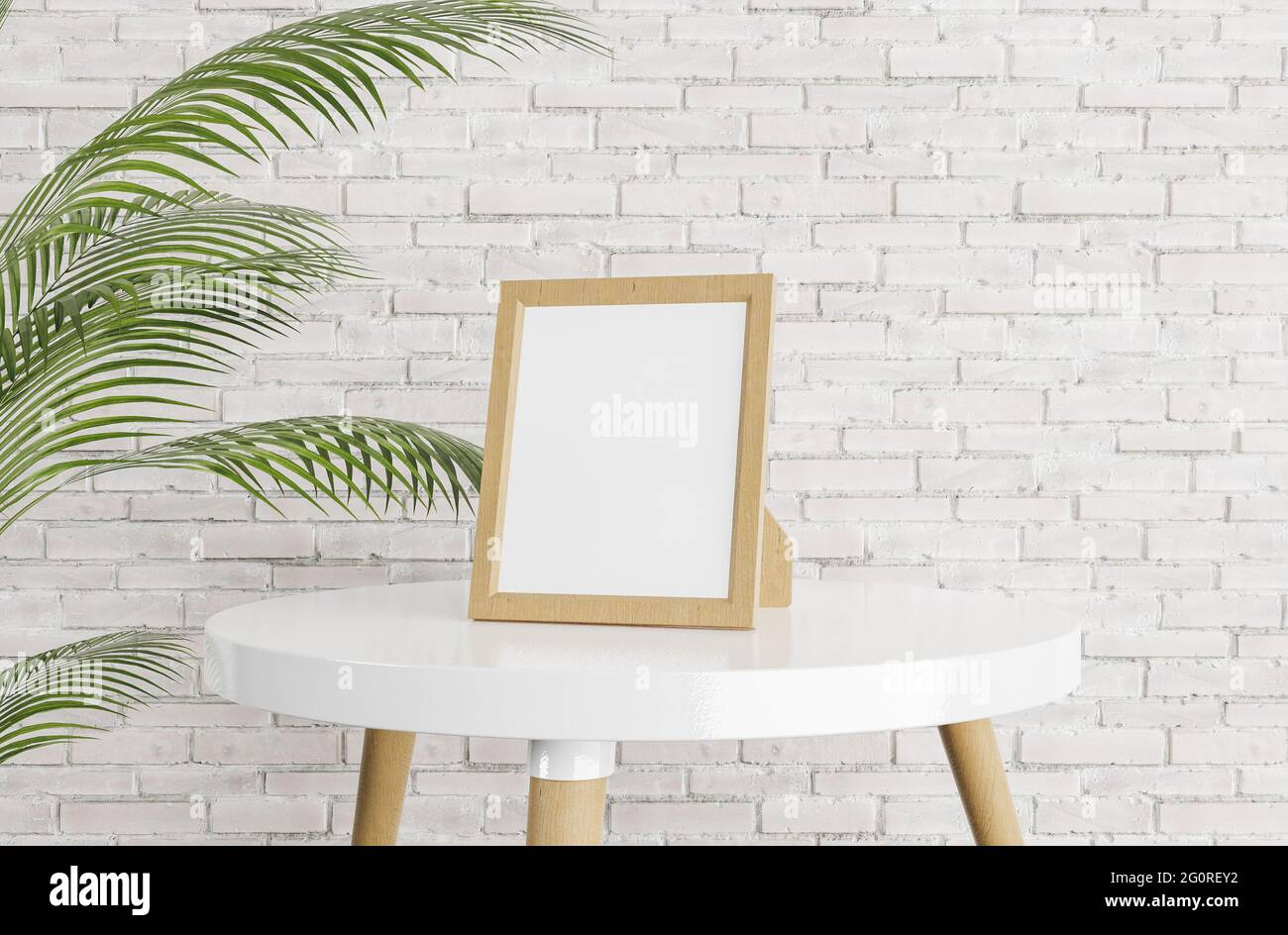 mockup of portrait frame on white coffee table with brick wall in the  background and potted leaves on one side. bright room. 3d render Stock  Photo - Alamy