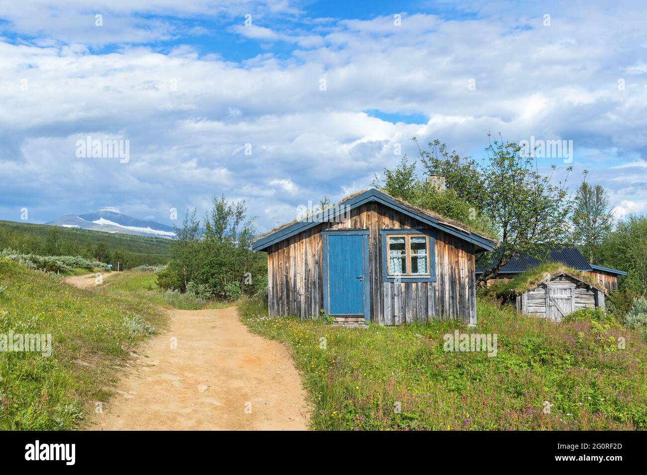 Mountain cabin at a footpath in the mountains Stock Photo
