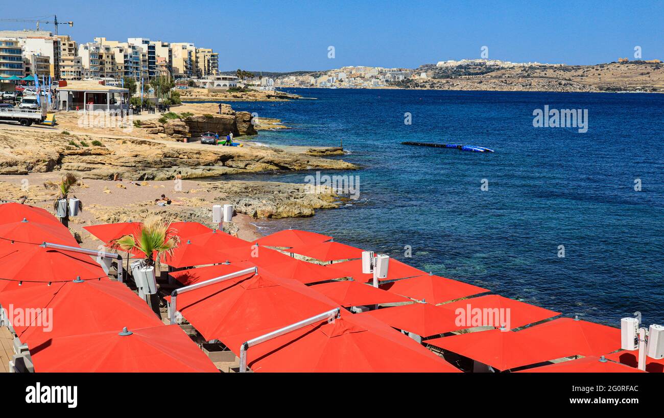 Sun shades on the beach at Bugibba. Malta Stock Photo - Alamy