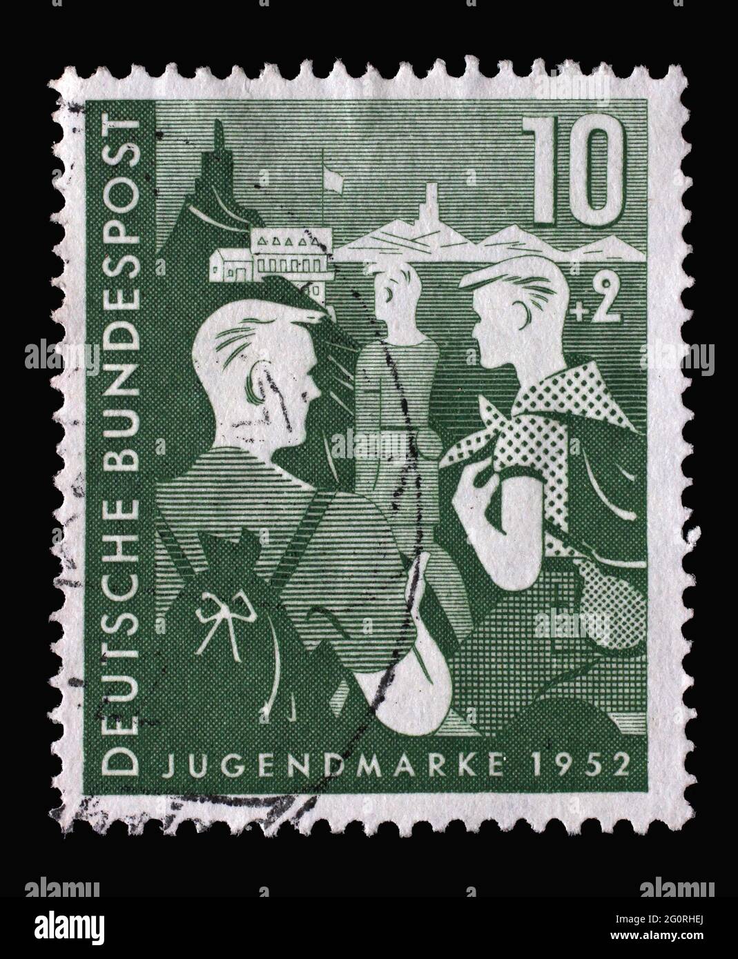 Stamp printed in Germany, shows Wandering girls, Youth Hostel, circa 1952 Stock Photo