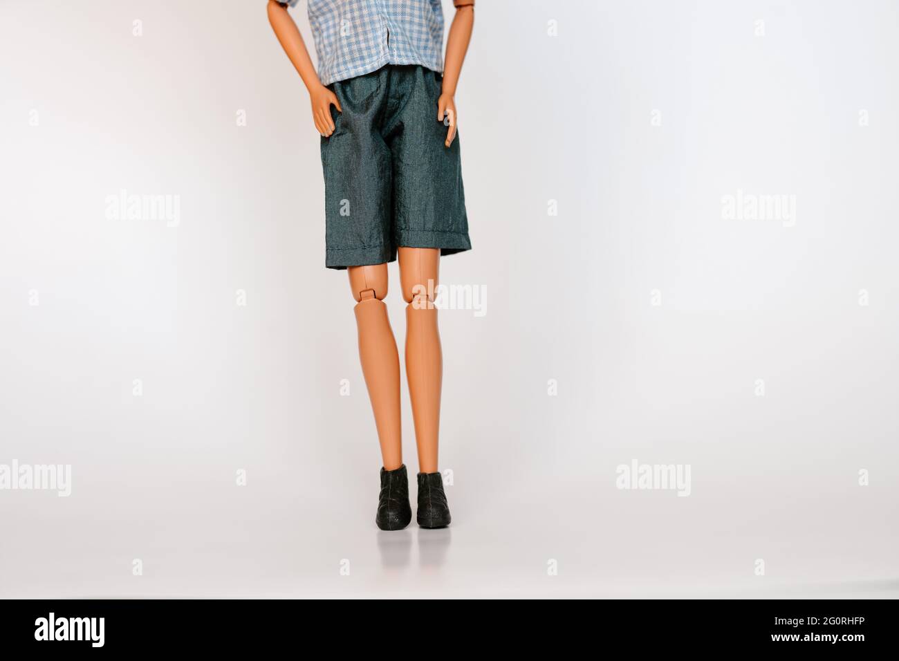 Tom boy doll on white background front view. Gender fluid non-binary concept Stock Photo